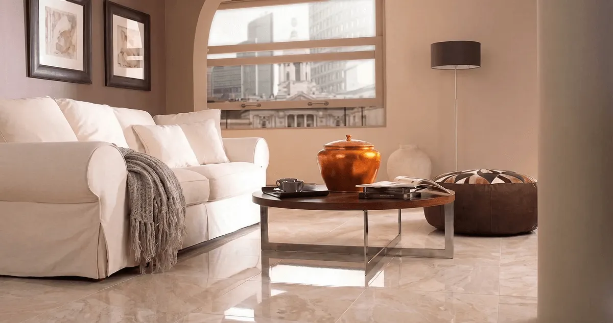 Modern living room with professionally installed marble flooring, a beige sofa, coffee table in Colorado Springs, CO