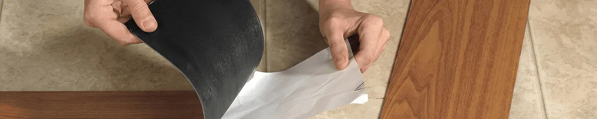 A professional installing vinyl flooring in Colorado Springs, CO